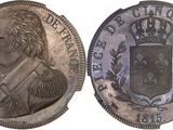 a close up of a coin with a coat of arms on it