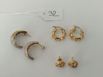three pairs of gold and silver earrings and a pair of gold and silver earrings