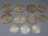 six different types of coins are arranged on a table