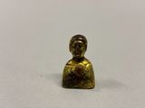 a close up of a small figurine of a person holding a heart