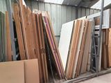 a lot of different types of doors and windows in this warehouse