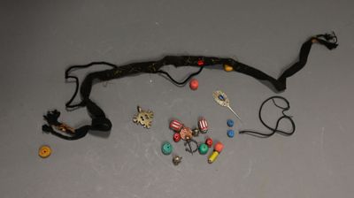 a bunch of jewelry that is laying out on the table
