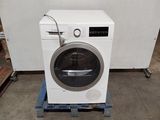 an image of a washing machine in a warehouse