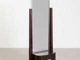 an image of a large mirror sitting on top of a wooden stand