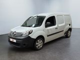 the white van is parked in a large room with a black floor