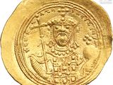 a close up of a gold coin with an image of a man on it