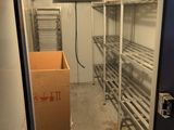 a room with shelves and a box in it