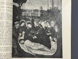 an open book with a picture of a group of people on it