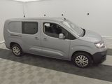 the grey van is parked in a clean room with a checkered floor