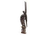 sculpture of a bird on a branch with a bird on it ' s head