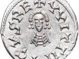 a close up of a silver coin with an image of a woman on it