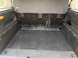 the back of a van with the door open showing the cargo area