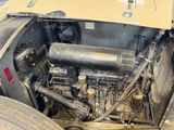 a close up of an old car engine with a lot of rust on it
