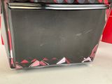 a black and red toaster sitting on a counter