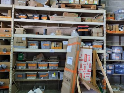 many boxes and boxes on the shelves in the room