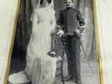 an old photo of a man and a woman posing for a picture
