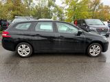 a picture of a black car parked in a parking lot