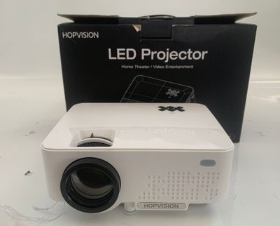 an image of a white projector sitting on top of a white table