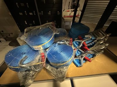 many blue plastic bowls and other items on a table