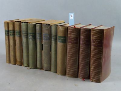 several old books are stacked on top of each other on a table