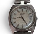a silver wrist watch with roman numerals on it