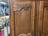 a large wooden armoire with carvings on it