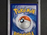 a close up of a pokemon card on a black surface