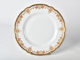 a white plate with gold trim on it