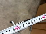 a measuring tape that is being held up by a person