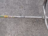 a bicycle chain with a sticker on it laying on the ground