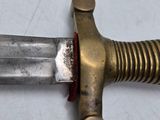a close up of a knife on a table