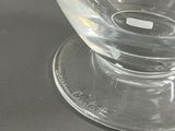 a clear glass bowl on a clear plate on a table