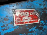 a sign that is on the side of a blue wall