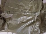 a bag with a zipper on it sitting on a table