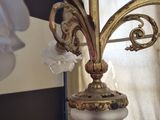 a lamp that is sitting on a table in front of a window