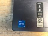a close up of a laptop with a qr code on the screen