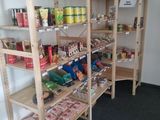 a wooden shelf with various items on it in a room