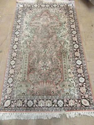 an oriental rug on the floor in a living room