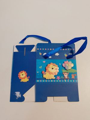 a blue gift bag with a picture of a lion on it
