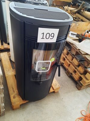 an image of a large black stove in a warehouse