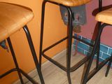 three stools that are next to each other in a room
