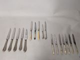 a lot of knives and knives that are on the table