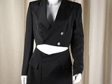 an image of a mannequin wearing a black jacket and skirt