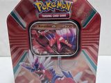a close up of a pokemon trading card game in a tin