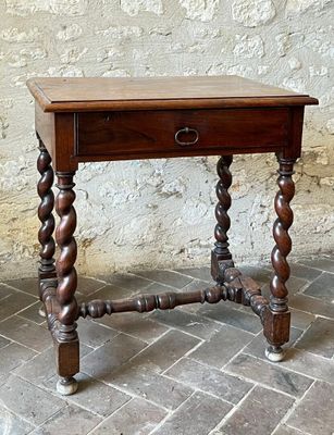 a small wooden table with a drawer on top of it
