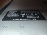a close up of a laptop with a hard drive attached to it