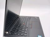 a close up of a laptop computer on a white surface