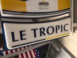 a sign that says le tropic on the side of a building