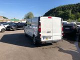 a white van that is parked in a parking lot