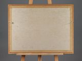 a picture of an easel with a blank canvas on it
